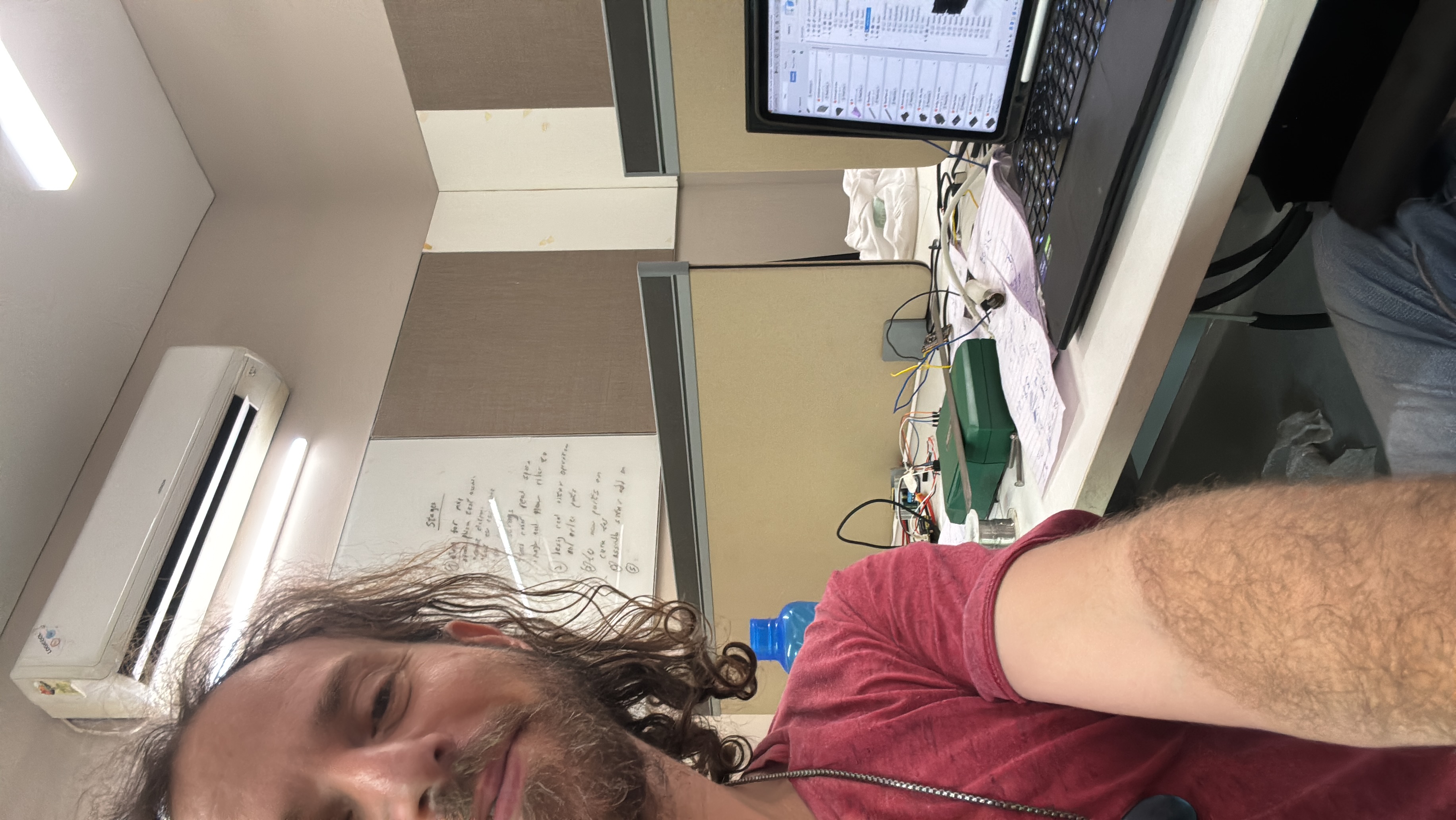 Yoav Fekete in the lab among prototyping electronics